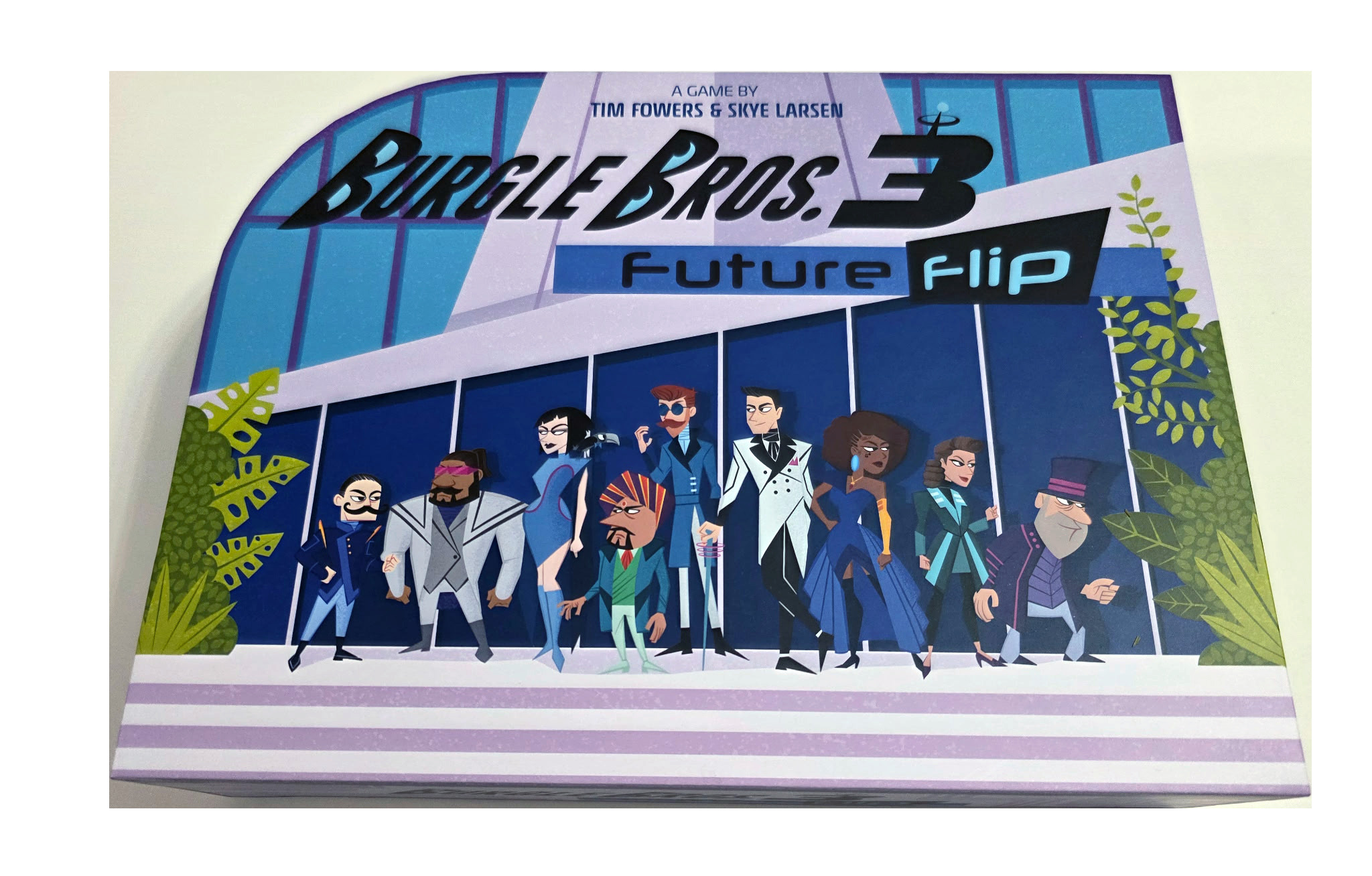Official Fowers Games product art for Burgle Bros 3: Future Flip: the cyberpunk co-op heist box landing in UK and EU shops this week after the crowdfunding run.