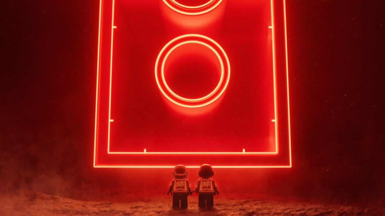 Daft Punk minifigures face a glowing red brick in the LEGO and Daft Punk announcement film (LEGO Group / Daft Punk).