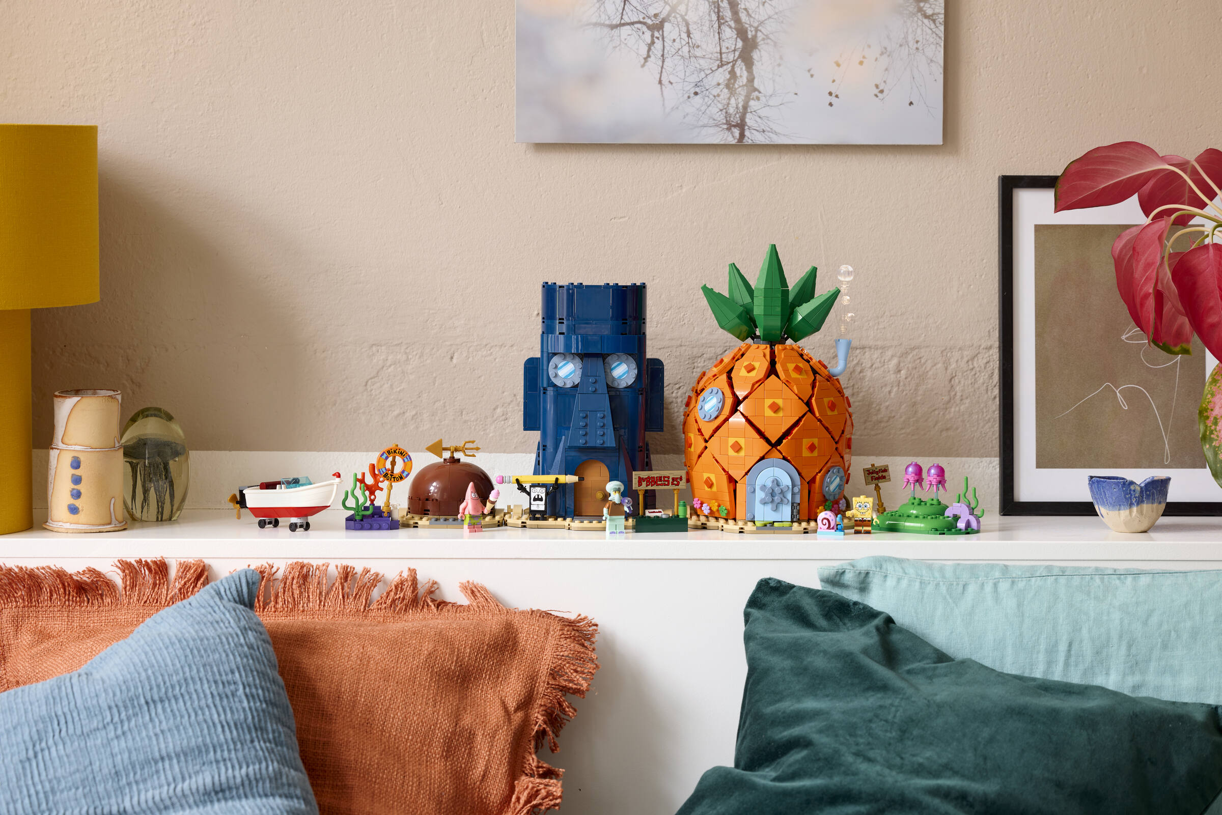 Official LEGO lifestyle still of set 11386 SpongeBob SquarePants: Bikini Bottom with pineapple, Squidward house, and Patrick rock. The LEGO Group.