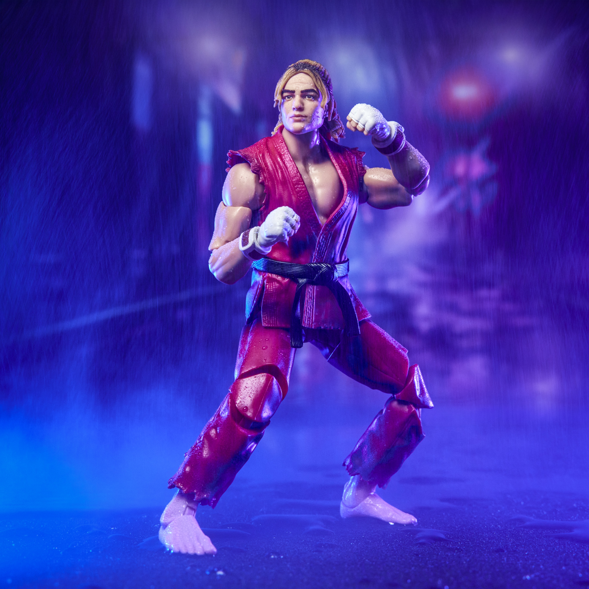 Hasbro Street Fighter movie Ken 6-inch figure product still, rainy neon lifestyle. Hasbro / coverage via Bleeding Cool.