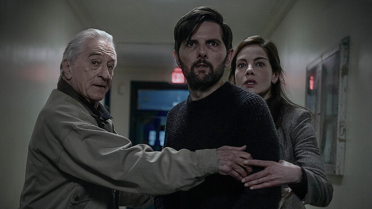 Official still of Robert De Niro, Adam Scott, and Michelle Monaghan in The Whisper Man. David Lee / Netflix.