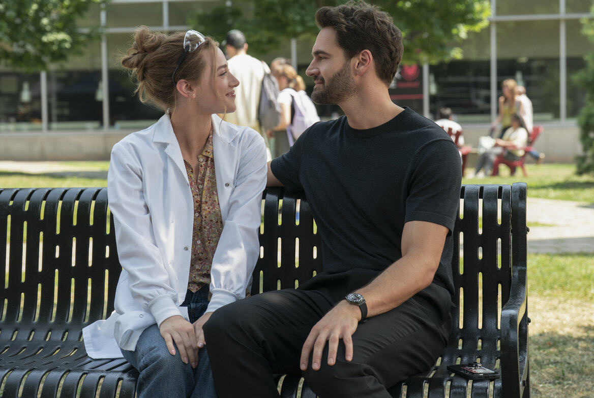 Lili Reinhart as Olive Smith and Tom Bateman as Dr. Adam Carlsen in The Love Hypothesis. Photo by Philippe Bossé / Prime Video. © Amazon Content Services LLC.